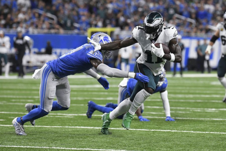 Philadelphia Eagles wide receiver A.J. Brown tries to avoid the tackle of Detroit Lions safety Tracy Walker III in the first half on Sunday, Sept. 11, 2022.